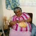 Agnes Mcgee working on baskets in Mary George's kitchen.  Photo courtesy of Rita Pimlott